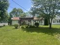 Spacious backyard with a pergola, perfect for outdoor entertaining at 1919 Manor Dr, Lebanon, IN 46052