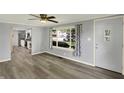 Inviting living room with modern flooring, neutral paint, and large windows offering plenty of natural light at 217 W Burnside Ave, Fairland, IN 46126