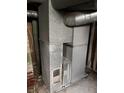 Close-up shot of the furnace, featuring metal ducts and showing signs of wear and tear at 2742 Allen Ave, Indianapolis, IN 46203