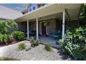 Welcoming front porch with comfortable seating, landscaping, and a charming entrance, perfect for relaxation at 2756 Bluebell E Ct, Columbus, IN 47201