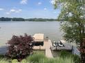 View of boat dock, boat lift and personal watercraft on beautiful lake at 3154 Beach Blvd, Cicero, IN 46034