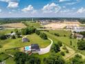 The property features lush greenery, a pool, and a long private driveway at 320 Briar Hill Dr, Whiteland, IN 46184