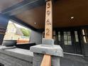Covered front porch with address displayed on post in decorative font at 3962 Graceland Ave, Indianapolis, IN 46208