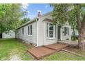 Quaint single-story home featuring classic siding, a bay window, and a cozy front porch at 4517 E 16Th St, Indianapolis, IN 46201