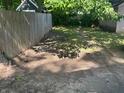 View of the backyard showing the lawn space and wooden fence at 4723 Crittenden Ave, Indianapolis, IN 46205