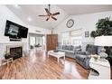 Spacious living room with high ceilings, fireplace, and open layout to the dining area at 5217 Dunewood Way # 3002, Avon, IN 46123