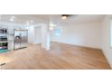 Bright, open-concept living space with wood flooring that flows into the modern kitchen at 608 Manhattan Ave, Indianapolis, IN 46241