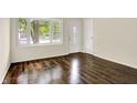 Bright living room with bay window, hardwood floors, and natural light at 6108 Penway St, Indianapolis, IN 46224