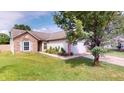Well-maintained home with brick accents, tidy landscaping, and an attached two-car garage at 6640 Chipping Ct, Indianapolis, IN 46268