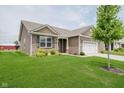 Single-Gathering home with brick and vinyl siding, an attached two-car garage, and well-maintained landscaping at 6644 Aberdeen Dr, McCordsville, IN 46055