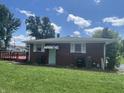 View of home's backyard with a lovely deck, perfect for outdoor entertaining and relaxation at 7725 S Oak Dr, Indianapolis, IN 46227
