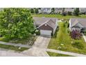 A charming home, with mature trees, is situated near a tranquil pond in a desirable neighborhood at 8778 N Deer Crossing Blvd, McCordsville, IN 46055