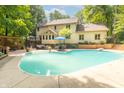 Backyard with an in-ground pool and outdoor seating area perfect for entertaining and relaxation at 10518 Courageous Dr, Indianapolis, IN 46236