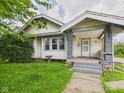 Charming single-Gathering home featuring a covered porch and mature landscaping at 1201 Arrow Ave, Anderson, IN 46016