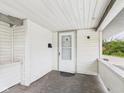 A covered porch featuring a storm door and a mailbox at 1201 Arrow Ave, Anderson, IN 46016