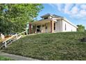 Charming single Gathering home featuring a landscaped front yard and inviting front porch at 1430 W 14Th St, Anderson, IN 46016