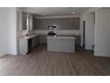Open-concept kitchen featuring a center island, stainless steel appliances, and ample cabinet space at 17110 Cowbell Dr, Noblesville, IN 46060