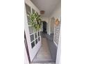 Inviting entryway with open door, decorative wreath, and a view of the interior space of the home at 249 N Mill St, Plainfield, IN 46168