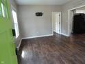 Spacious living room with modern flooring and abundant natural light from the window at 2502 N Harding St, Indianapolis, IN 46208
