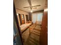 This bedroom offers twin beds and a ceiling fan at 3709 N Layman Ave, Indianapolis, IN 46218