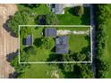Aerial view showcasing the home's layout, large lot, detached garage and surrounding greenery at 5081 N 500 W, Fairland, IN 46126