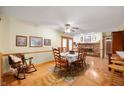 Inviting dining room featuring hardwood floors, fireplace, with wooden dining table set and decor at 5081 N 500 W, Fairland, IN 46126