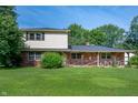 Charming brick and vinyl two-story home with a covered front porch and spacious lawn at 5081 N 500 W, Fairland, IN 46126