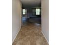 Hallway with ceramic tile floors leading to large windows with natural light at 614 Corbin Way, Avon, IN 46123