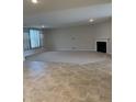 Large living room featuring neutral walls, carpet, and fireplace at 614 Corbin Way, Avon, IN 46123