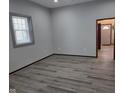 Bedroom featuring hardwood floors, neutral paint, and natural light at 624 Warren Ave, Indianapolis, IN 46221