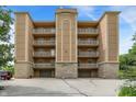 Condominium exterior featuring covered parking and upper-level balconies, perfect for relaxation at 6640 Page Blvd # 101, Indianapolis, IN 46220