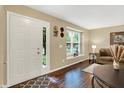 Bright entryway features wood floors, and a view of the front yard at 7215 Braxton Dr, Noblesville, IN 46062