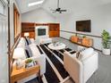 Bright living room featuring vaulted ceiling, built-in shelving, and fireplace, creating a cozy and inviting space at 757 Winter Way, Carmel, IN 46032