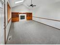 Bright living room with vaulted ceiling and built-in shelving, offering a versatile space for relaxing and entertaining at 757 Winter Way, Carmel, IN 46032
