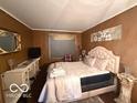 Comfortable bedroom with a decorative vanity and natural light at 7918 Bonita Ct, Indianapolis, IN 46219