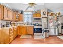 Functional kitchen featuring classic wood cabinetry, stainless steel appliances, and a ceiling fan at 850 Duane St, Franklin, IN 46131