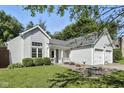 Inviting single-Gathering home with a covered porch, well-maintained landscaping, and a two-car garage at 8929 Sunburst Cir, Indianapolis, IN 46227