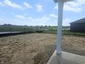 Backyard view towards neighborhood pond and green space at 114 Velvet Hat Rd, Danville, IN 46122