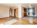 Spacious living area leads to a kitchen, offering an open layout with hardwood flooring at 1310 S Catherwood Ave, Indianapolis, IN 46203