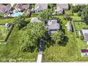 An aerial view of the home shows the large lot, mature trees, and neighborhood at 1325 Fordice Rd, Lebanon, IN 46052