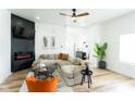 Cozy living room with fireplace, modern furniture, and ample natural light at 1425 Kennington St, Indianapolis, IN 46225