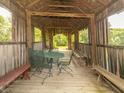 The interior of the covered bridge with seating and a view of surrounding greenery at 1595 N 400 W, Greenfield, IN 46140