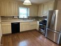 Functional kitchen with stainless steel appliances, gas range, and plenty of cabinet space at 2211 Rosedale Dr, Indianapolis, IN 46227