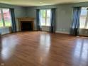 Bright living room boasting hardwood floors and a cozy fireplace at 2211 Rosedale Dr, Indianapolis, IN 46227