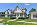 Classic two-story home with a cozy front porch, neat landscaping, and inviting curb appeal at 238 S 5Th Ave, Beech Grove, IN 46107