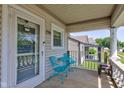 Cozy front porch features a seating area perfect for enjoying the outdoors and neighborhood views at 238 S 5Th Ave, Beech Grove, IN 46107
