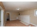 Inviting living room with hardwood floors and a classic brick fireplace at 320 N Colorado Ave, Indianapolis, IN 46201