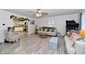Bright living room with modern flooring, cozy furniture, and an open layout at 335 Park St, Noblesville, IN 46060