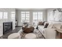 Bright living room with marble fireplace, balcony, and modern furniture at 372 S Meridian St, Greenwood, IN 46143