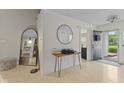 Bright foyer featuring a modern mirror and stylish table, creating an inviting entrance at 3843 Grove Tree Ln, Indianapolis, IN 46203
